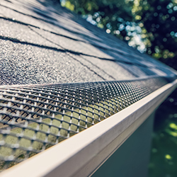 Gutter screens and micro-mesh covers shown on a home.